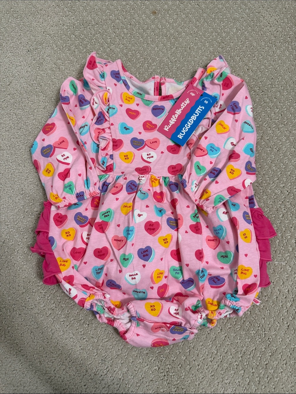 RuffleButts Pink Heart Candy Conversation Bubble One-Piece